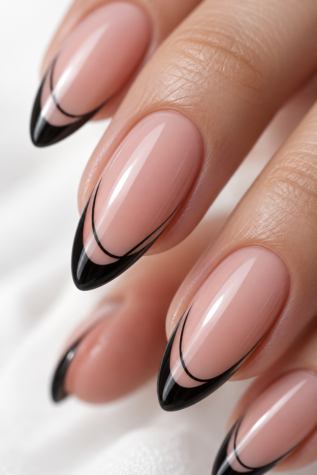 Illustrative close-up of nude-pink nails with thin black French line art
